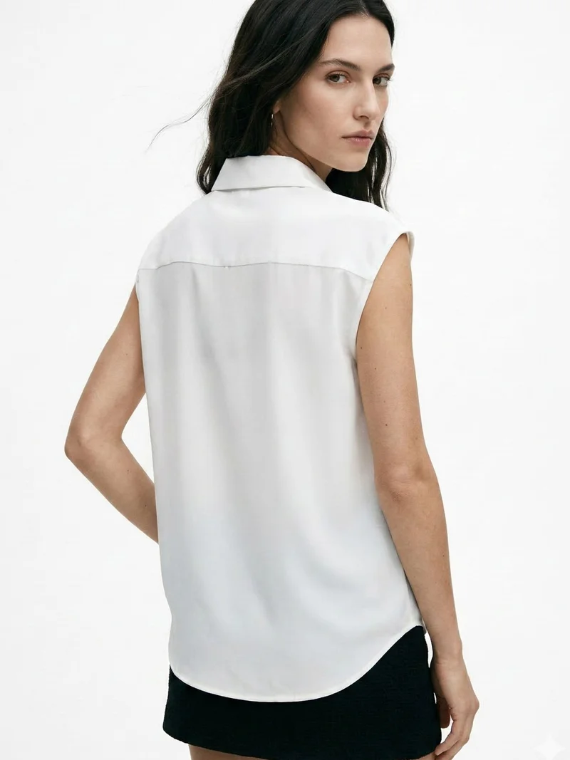Outzidr  Off White Sleeveless Tie-Neck Blouse for Women | Best Price UAE