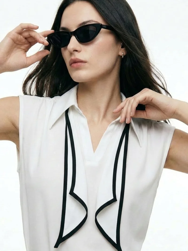 Outzidr Off White Sleeveless Tie-Neck Blouse