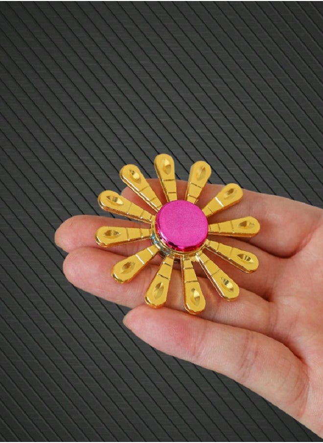 Spinner - Luxury Gold Zinc Alloy Fidget Spinner with 12 Arms Design with Pink Center  - Durable and Portable Handheld for Comfort and Focus Fidget Spinner - Image 1