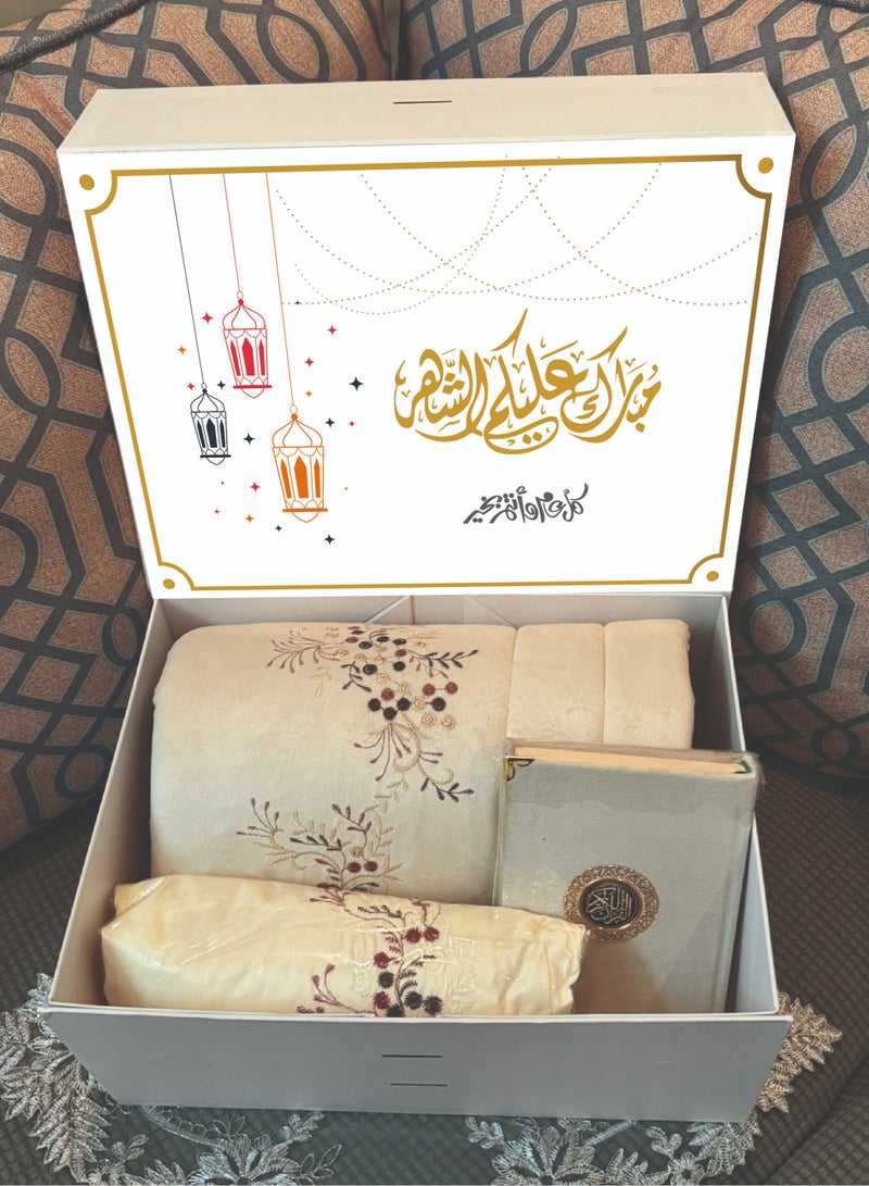 A set of carpet, prayer sheet and Qur’an for women