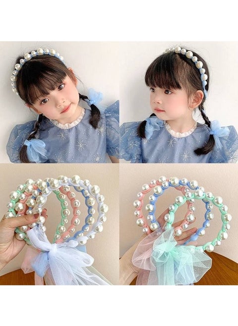 A hair tie with a ribbon for Luli