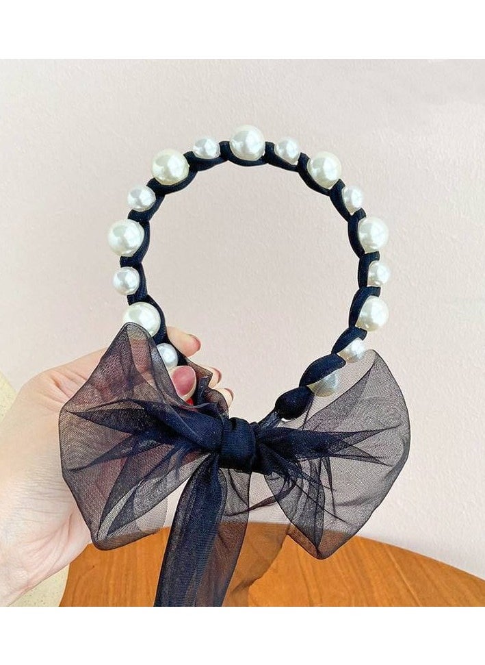 A hair tie with a ribbon for Luli