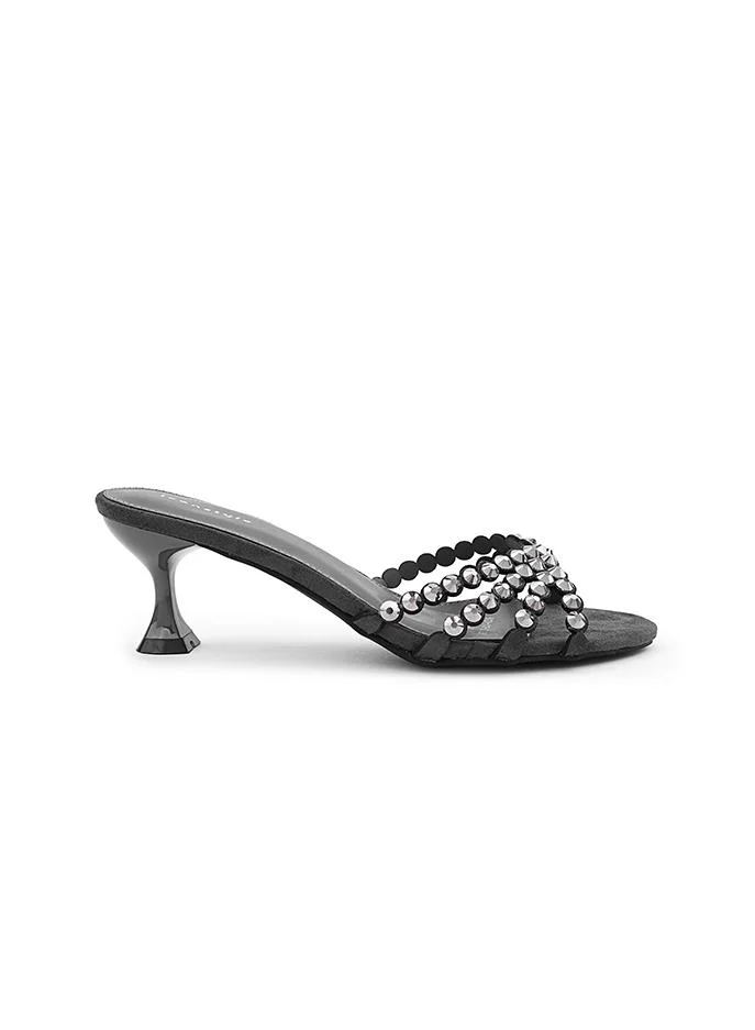أيقون Structured heel slipper with elegant textured surface.
