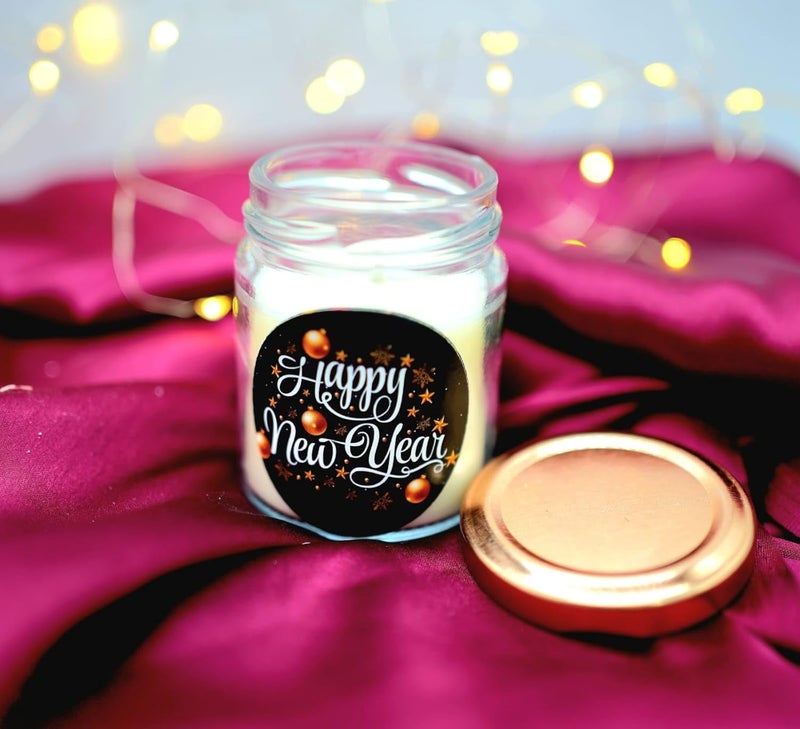 The Essenza Scented Candles in Glass Jars with Assorted New Year Stickers Festive Decorative Candles for Gifting and Home Dcor 1 - Image 1