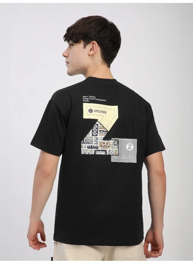 بيونغ تيشيرت فضفاض مطرز بحرف  باللون الأسود