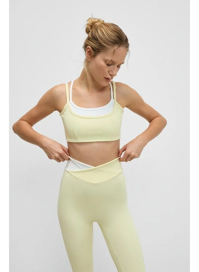 Urban Beat BLAZIX Women's Stretchy and Soft-Textured Yellow Sports Bra with Leopard Contrast and Adjustable Ring Straps.