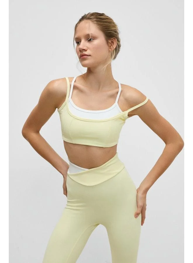Urban Beat BLAZIX Women's Stretchy and Soft-Textured Yellow Sports Bra with Leopard Contrast and Adjustable Ring Straps.