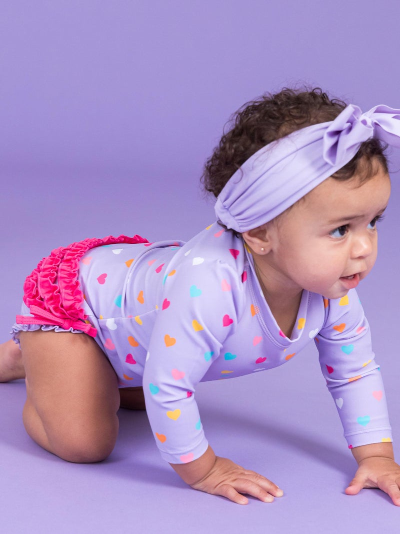 RuffleButts Baby Girls UPF 50+ Sun Protection Polka Dot Long Sleeve One Piece Rash Guard Swimsuit with Zipper - Lavender Colorful Hearts, 12-18m - Image 3