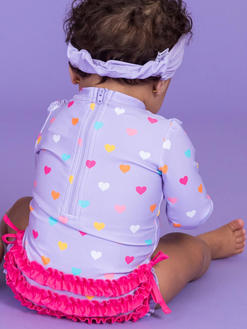 RuffleButts Baby Girls UPF 50+ Sun Protection Polka Dot Long Sleeve One Piece Rash Guard Swimsuit with Zipper - Lavender Colorful Hearts, 12-18m - Image 5