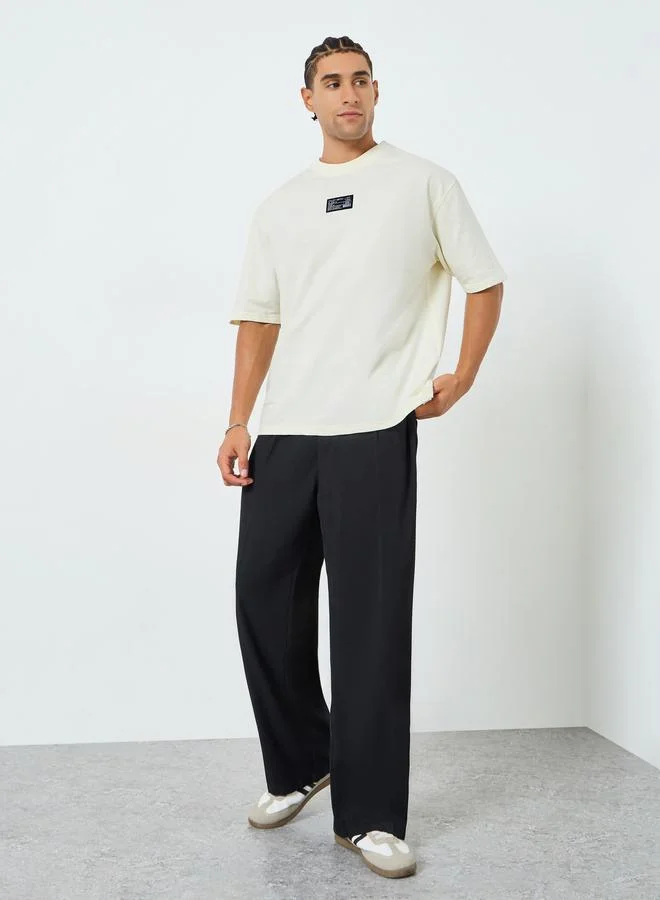 Styli Men Beige Graphic Print Oversized T-Shirt