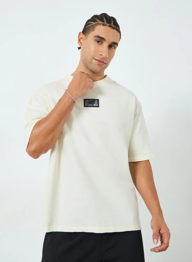 Styli Men Beige Graphic Print Oversized T-Shirt