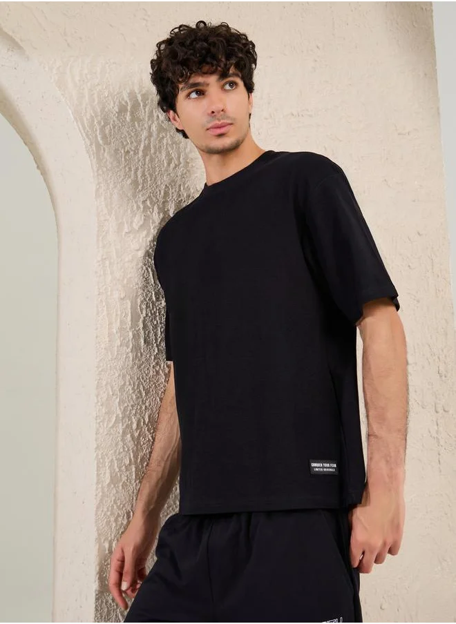 Styli Solid Badge Detail Oversized T-Shirt