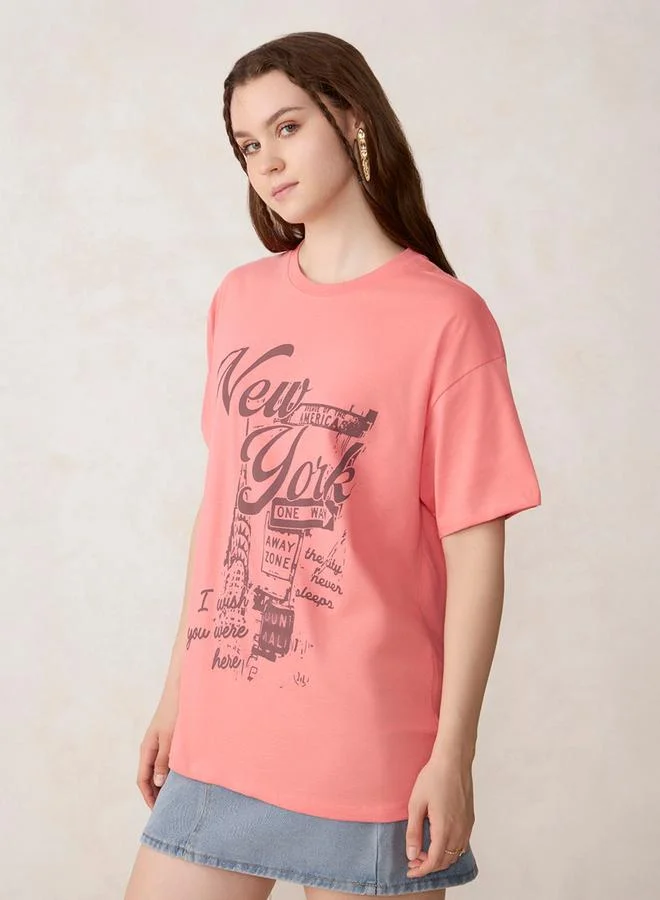 أوجيدر تيشيرت قطن واسع وردي بطبعة جرافيك