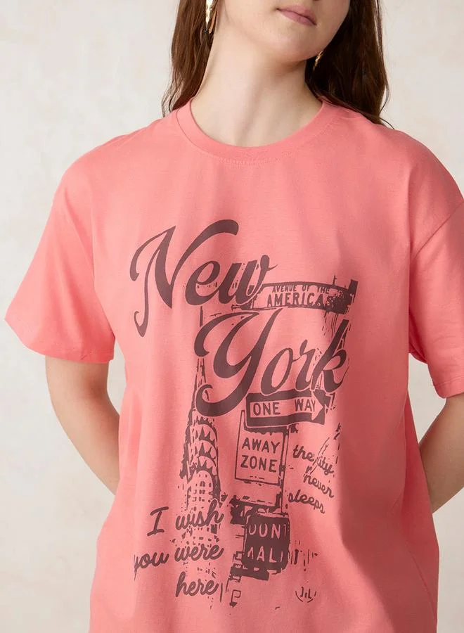 أوجيدر تيشيرت قطن واسع وردي بطبعة جرافيك