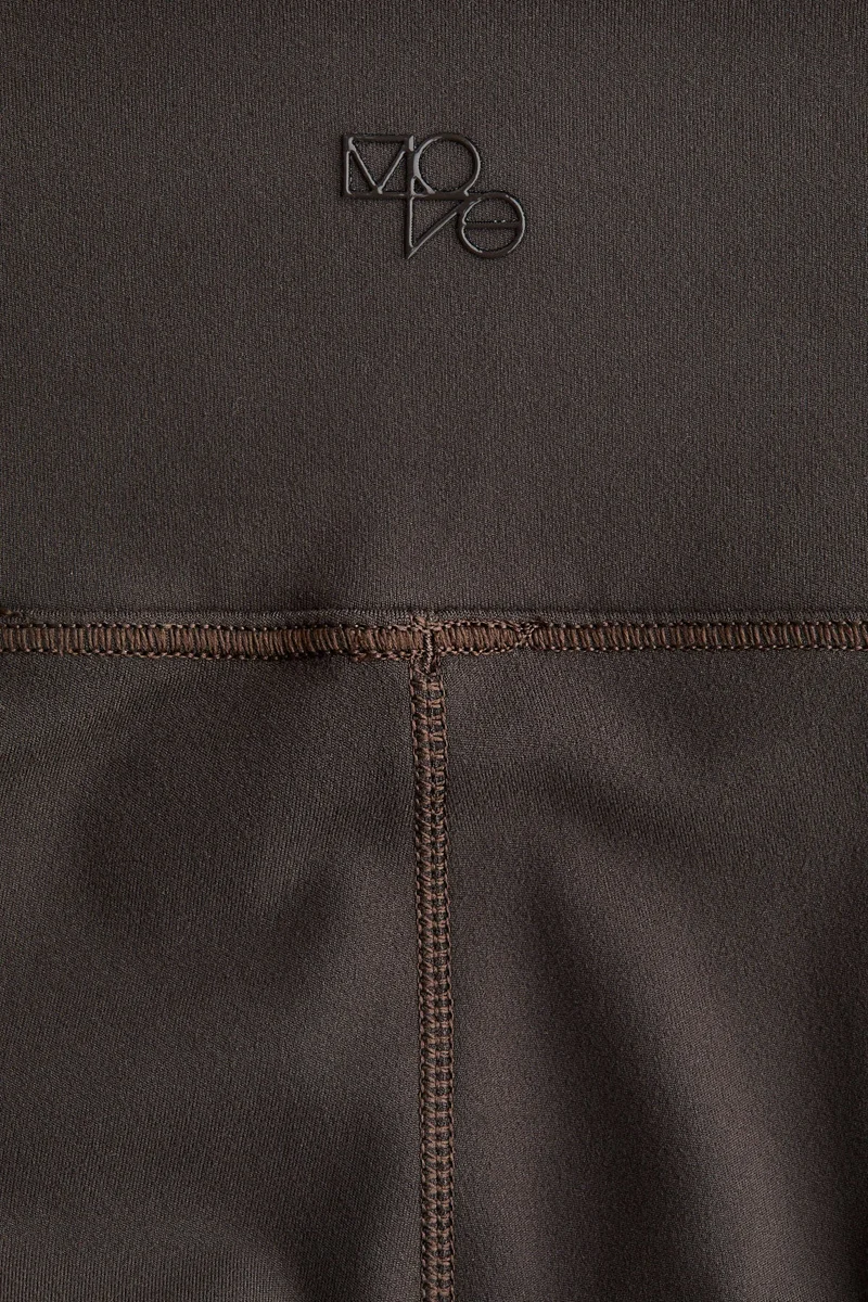 H&M SoftMove™ Flared sports trousers