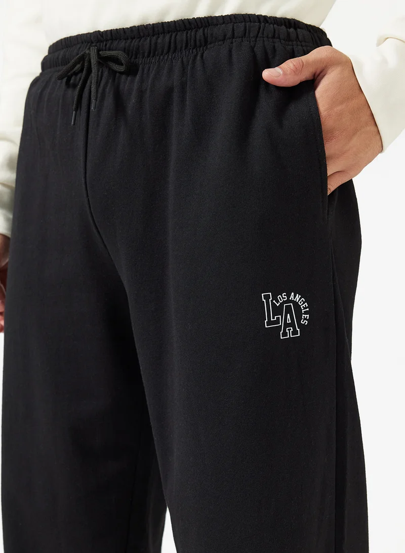 Seventy Five Basics  Text Print Open Hem Joggers for Men | Best Price UAE