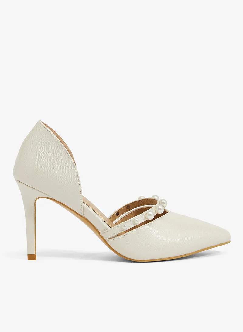 Gold glitter d'Orsay pump with large pearl strap and stiletto heel (Jimmy Choo)