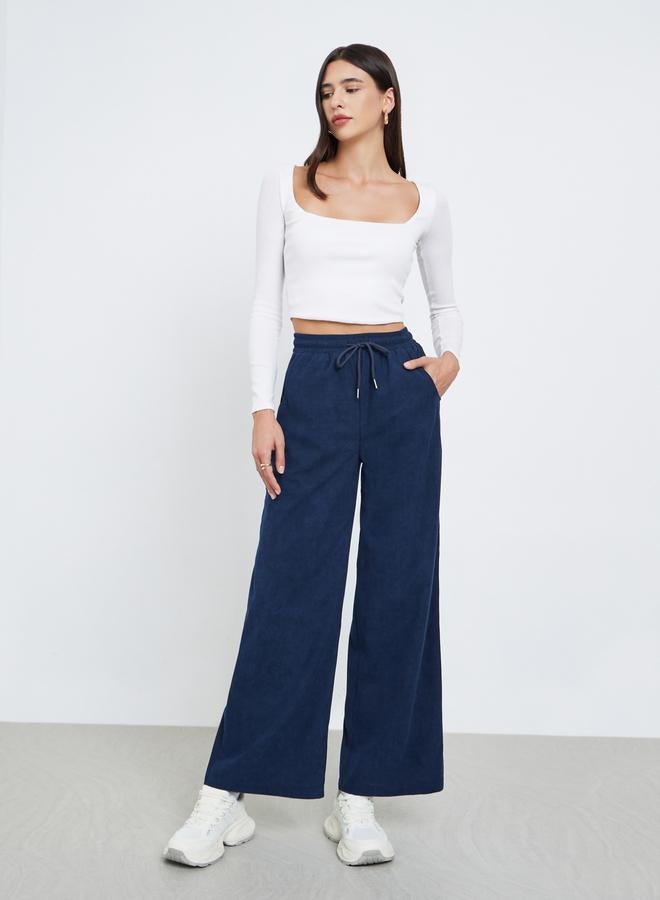 Styli Women Dark Blue Solid Corduroy Wide Leg Pants - Image 1