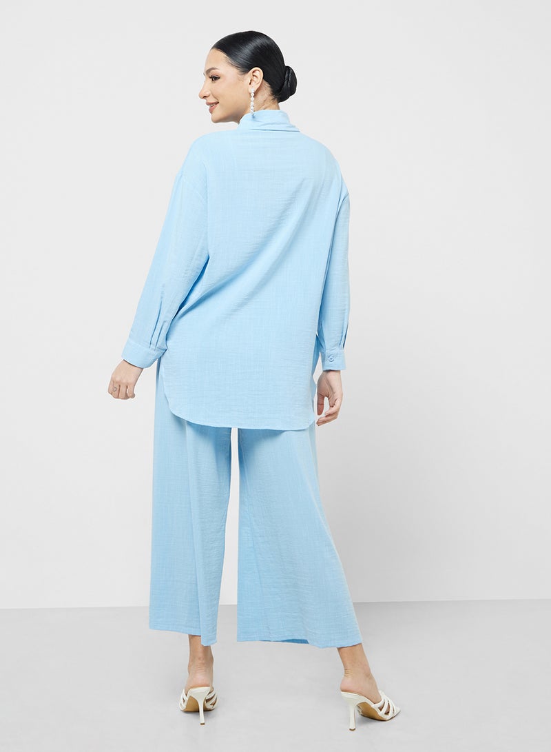 خزانة طقم قميص بأزرار وبنطلون واسع - Image 2