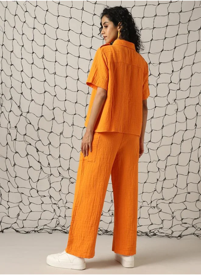 هوبرهولمي Women Co-ord in Orange featuring Oversized fit with a solid pattern, spread collar collar, spread collar neckline, half sleeves, regular length, secured with button closure, crafted from cotton – a wardrobe staple for modern fashion enthusiasts.