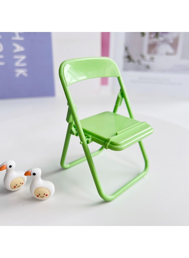 "A practical and lightweight plastic mobile phone holder that provides optimal stability for your phone while viewing or using it. Foldable and easy to carry, it's ideal for the office, home, or travel. " - Image 3