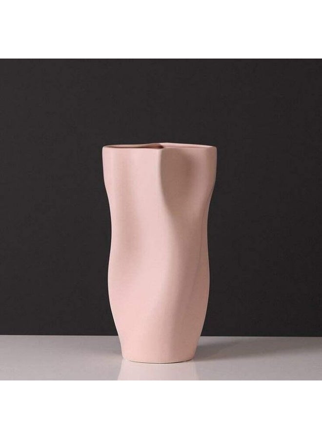 Razz Gallery The Pink Wavy Vase is a decorative piece that combines softness with artistic details to give any space a sense of luxury and harmony. - Image 1