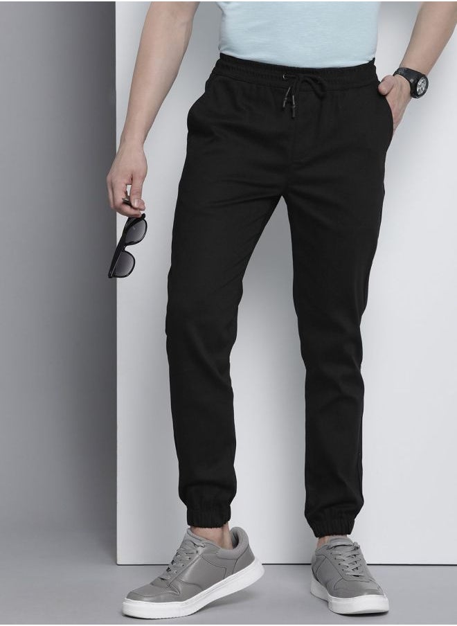 The Indian Garage Co Men Slim Fit Solid Mid-Rise Stretchable Chino Joggers  - Image 1