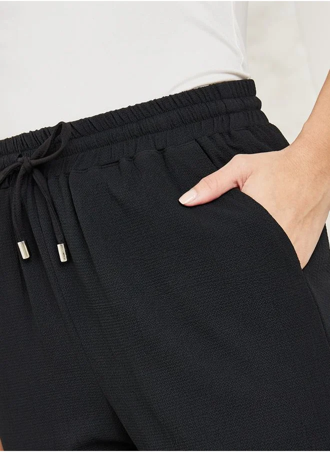 Styli Textured Tapered Fit Pants with Pockets