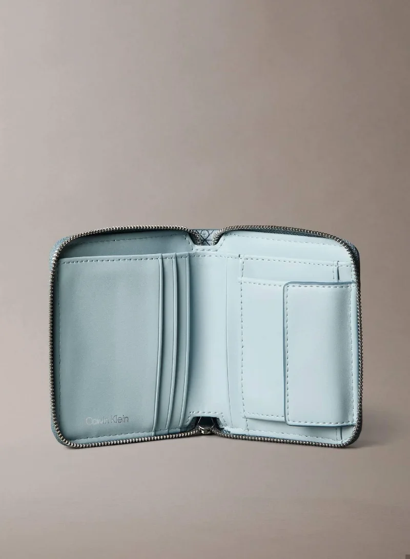 Calvin Klein PALEST BLUE AOP Zip Arround Wallet for Women | Best Price UAE