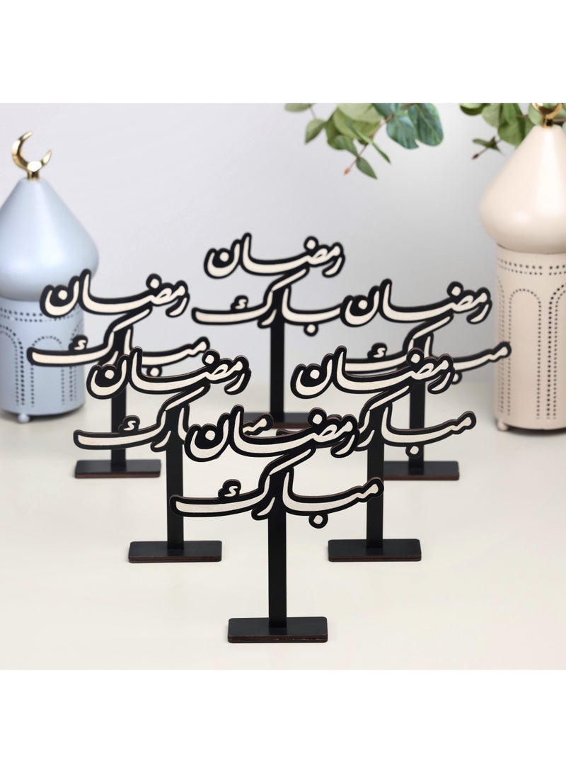 Story Of Candle Ramadan, a set of 6 black wooden Ramadan stands with an Arabic phrase - Image 1
