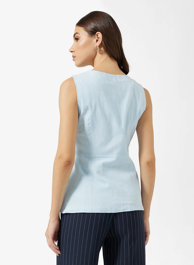 ايلا بلوزة بدون أكمام