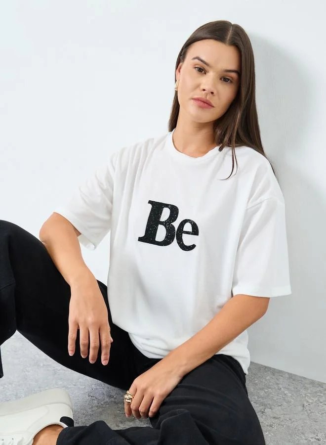 Styli Styli White Oversized Embellished Slogan T-Shirt
