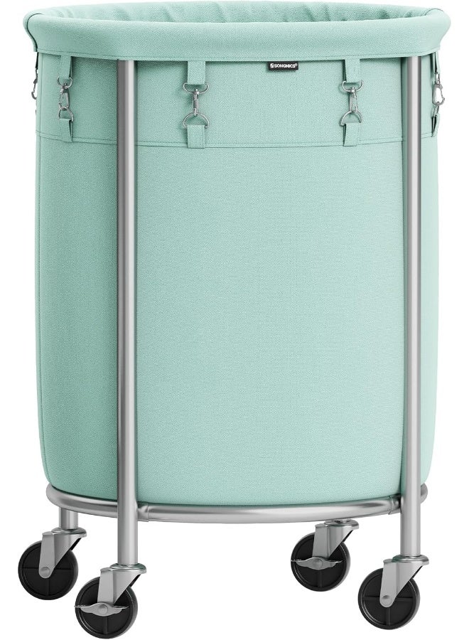 SONGMICS سلة غسيل SONGMICS بعجلات، سلة غسيل متحركة، سعة 29 جالون، عربة غسيل دائرية بإطار فولاذي وحقيبة قابلة للإزالة، 4 عجلات و2 فرامل، أخضر نعناعي وفضي معدني - Image 1