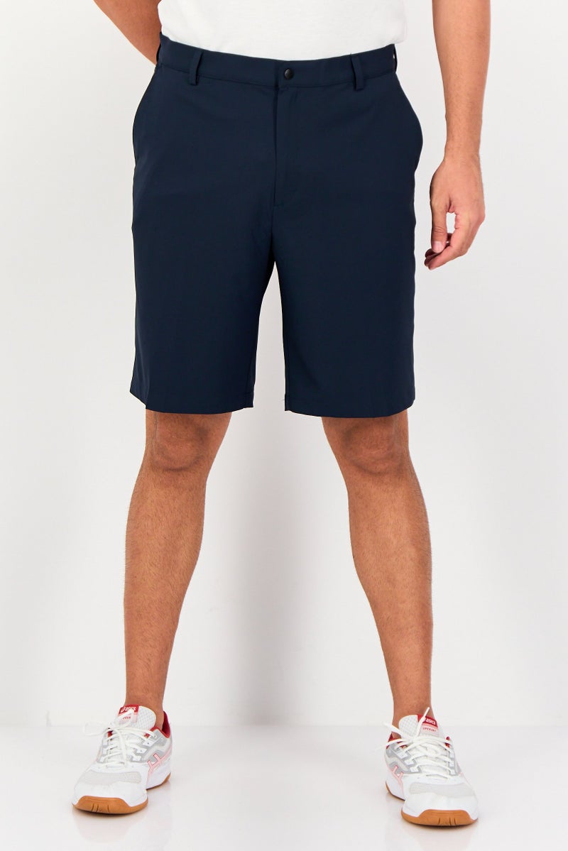 Greg Norman شورتات جولف رياضية للرجال، لون أزرق داكن - Image 1