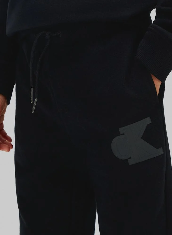 Calvin Klein Jeans BLACK [CSI] 25CW1000175CK Texured Logo Straight Leg Terry Joggers for Men | Best Price UAE