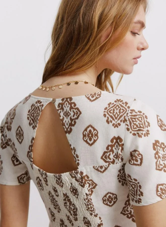 Springfield  Printed semi-fitted short sleeve shirt collar V-neck front button flared midi dress for Women | Best Price UAE