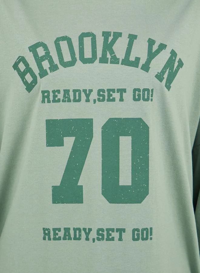Styli Brooklyn Varsity Print Exaggerated Sleeves Oversized T-Shirtâ€‹