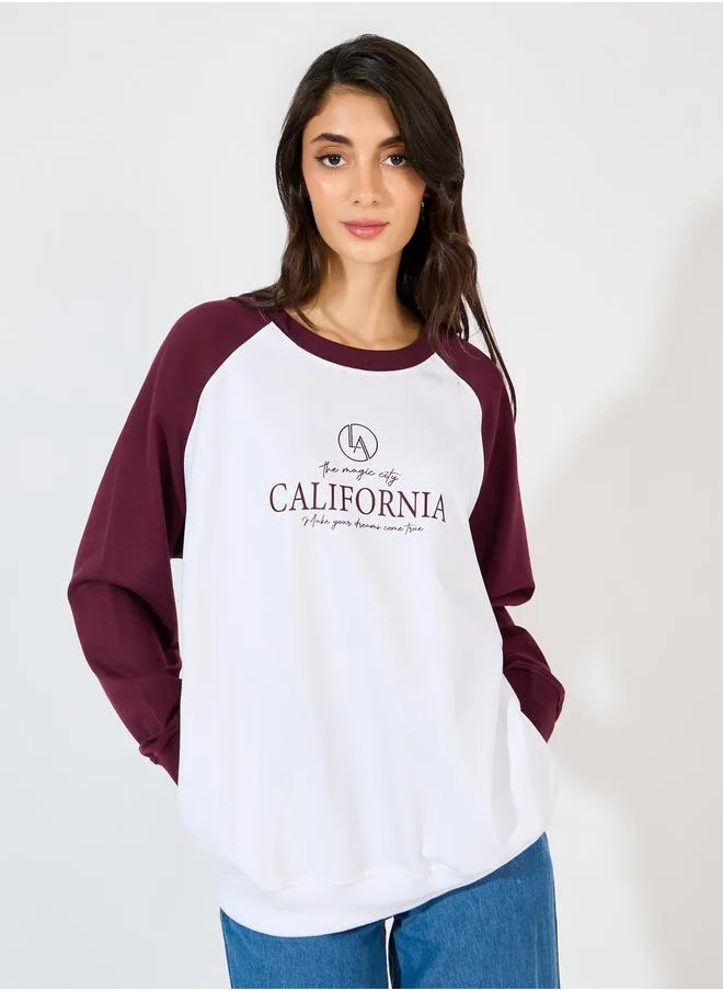 Styli Oversized Longline Slogan Print Sweatshirt