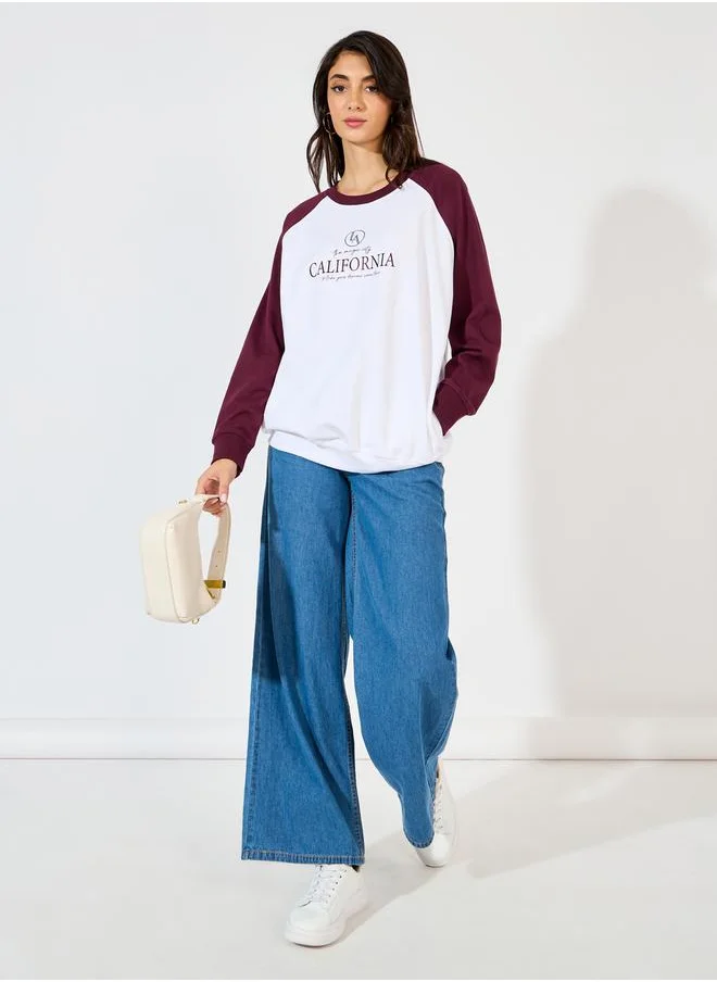 Styli Oversized Longline Slogan Print Sweatshirt