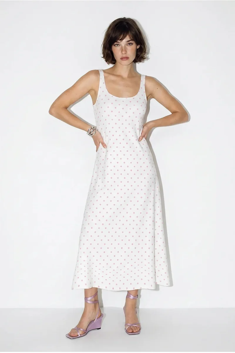 بيانكو لوتشي LUCCI Polka Dot Sleeveless Midi Dress With Tie Detail