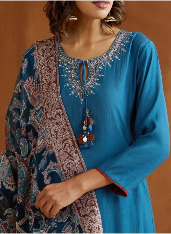 ISHIN Straight Fit Women Teal Poly silk Kurta Set with Embroidered pattern Tunic and Palazzo features a Round neckline and Three-Fourth Sleeve secured with Elastic closure and styled in Straight Fit ideal for Festive moments — crafted to elevate your special moments.