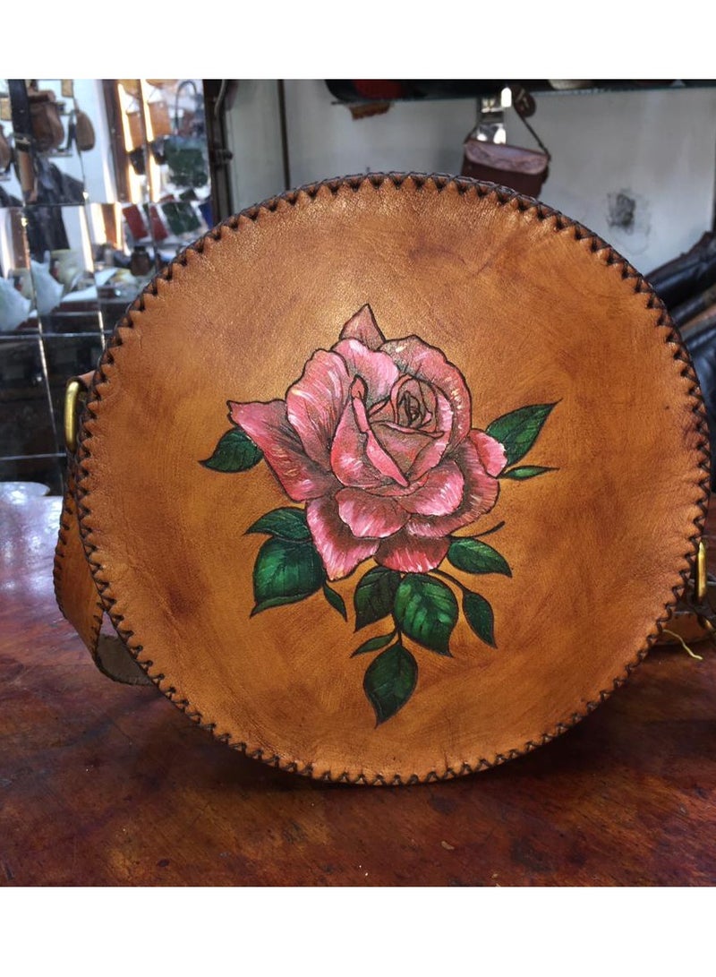 Medium-sized round bag made of natural leather, hand-made closure A suitable belt handle to adjust its length 2 zippers Lined with velvet from the inside Close with shiny thread  - Image 1