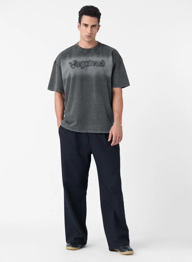 ذا سوليد ستور تيشيرت واسع مزين بكتابة مُمزقة