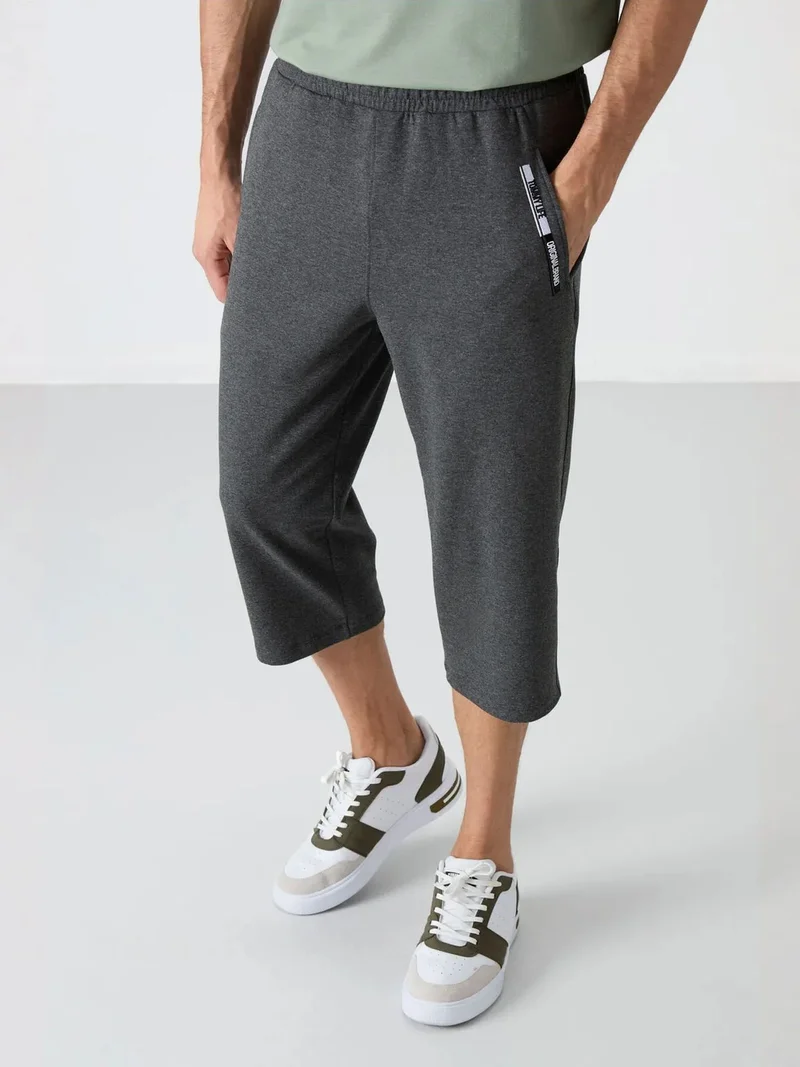 تومي لايف TOMMY Men's Mid-Waist Capri Shorts
