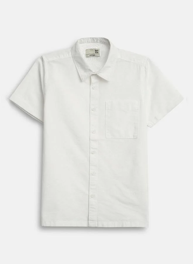 Bonkids Boy's shirts in regular fit white colour cotton fabric embellished pattern pull over closure woven weave type round collar type round neckline half sleeve length button down upper body wear type suitable for casual occasions – where comfort meets vibrant creativity!