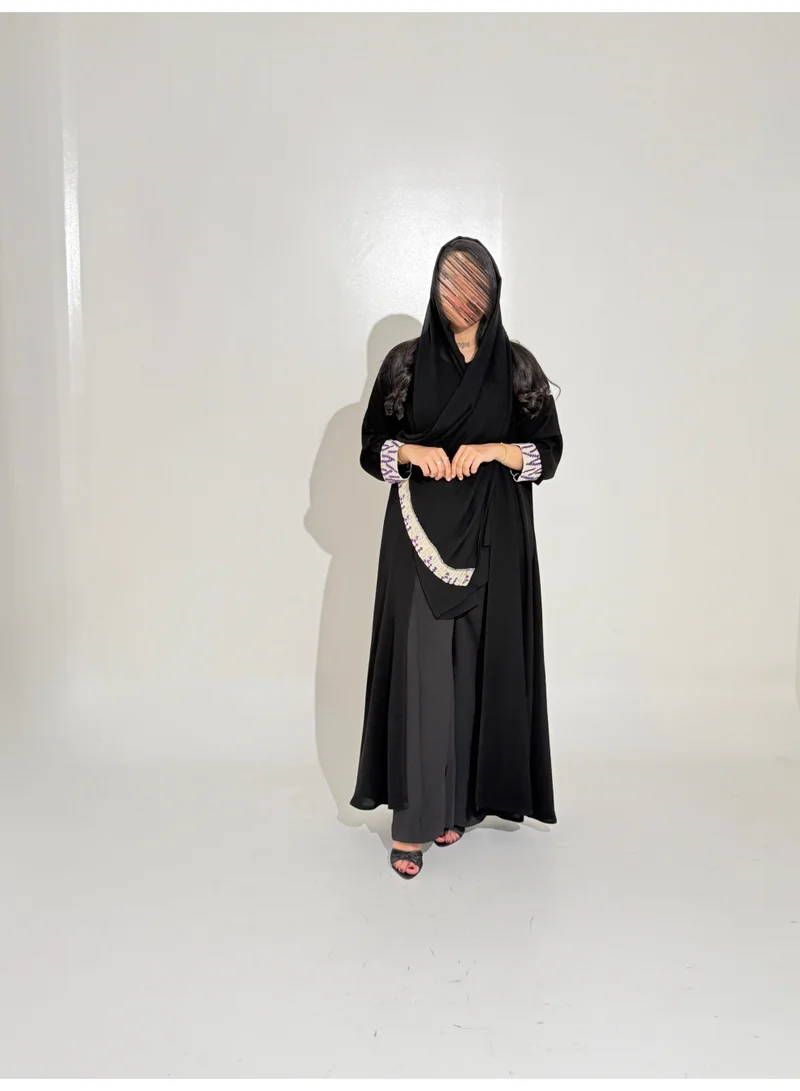 Tori-abaya Royal-style abaya with lavender-embroidered cuffs.