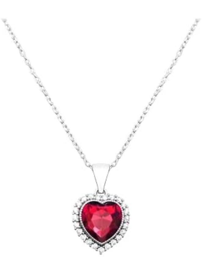 Luxuria A heart-shaped pendant set with a red ruby ​​and surrounded by a halo of clear stones. The pendant boasts a classic and romantic design, crafted from silver-plated stainless steel, and features cubic zirconia and synthetic rubies. - Image 1