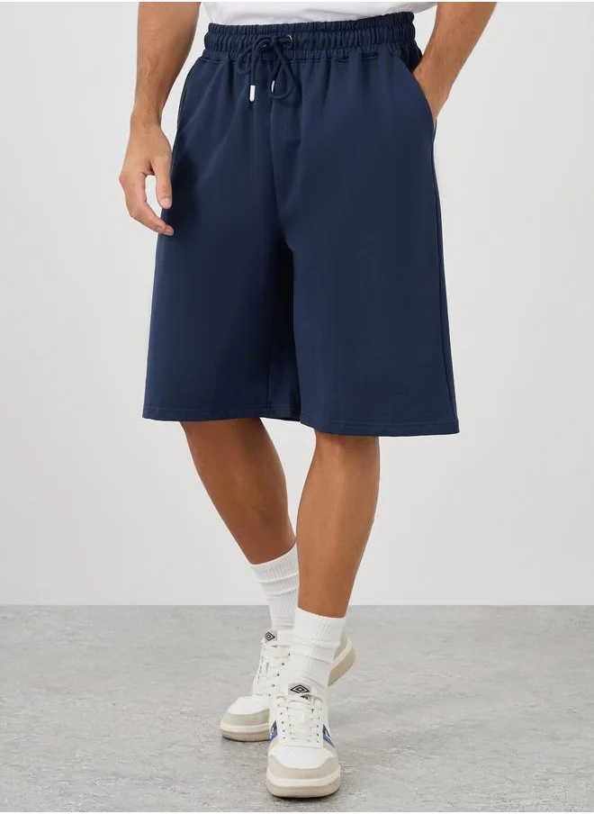 ستايلي Styli Oversized Solid Shorts with Drawstring