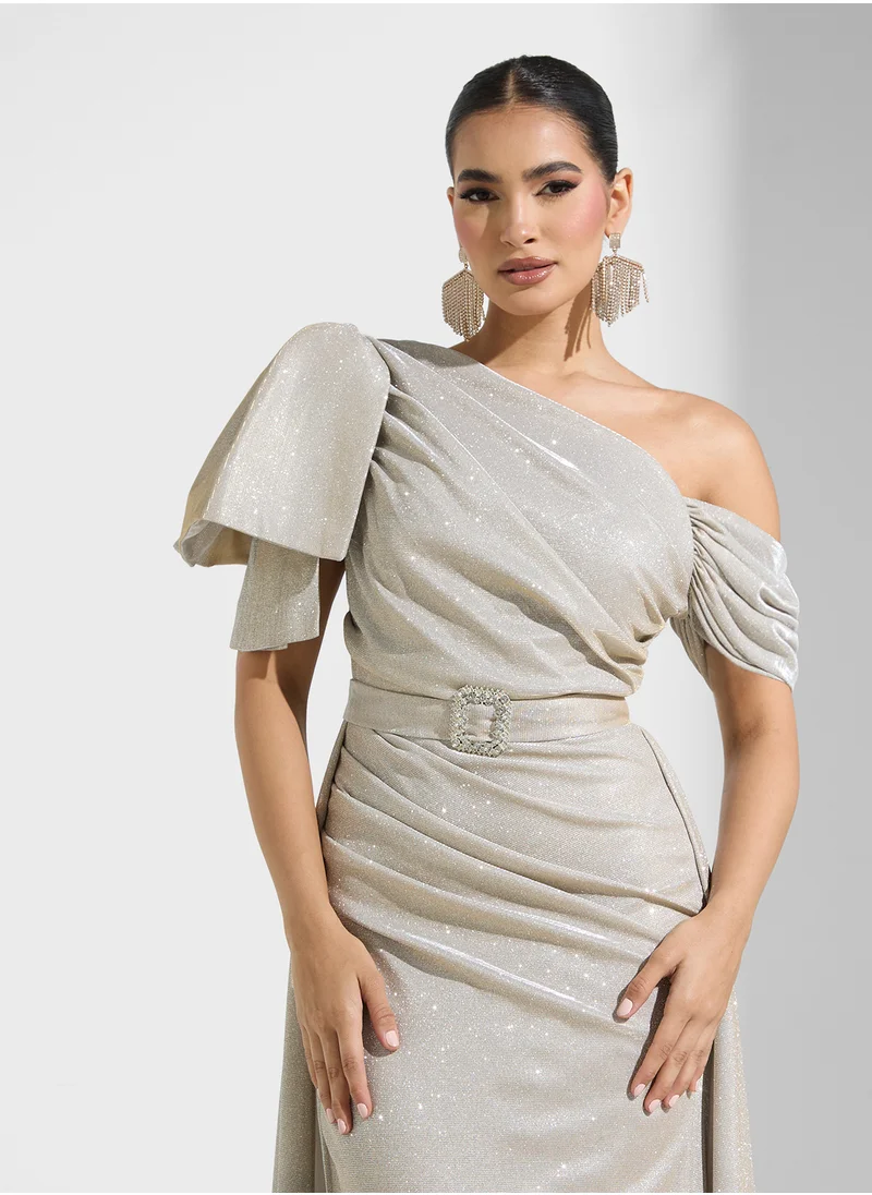 Namshi x Asymmetric Neck Shimmer Dress With Belt