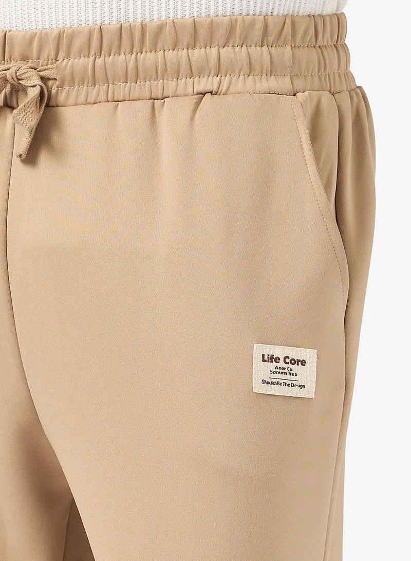 سفنتي فايف بيسيكس Relaxed Fit Emblem Joggers